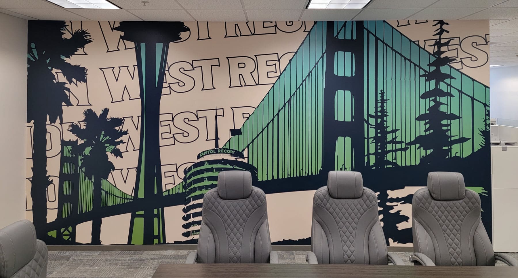 Conference room wall covered with a printed regional skyline mural behind the chairs