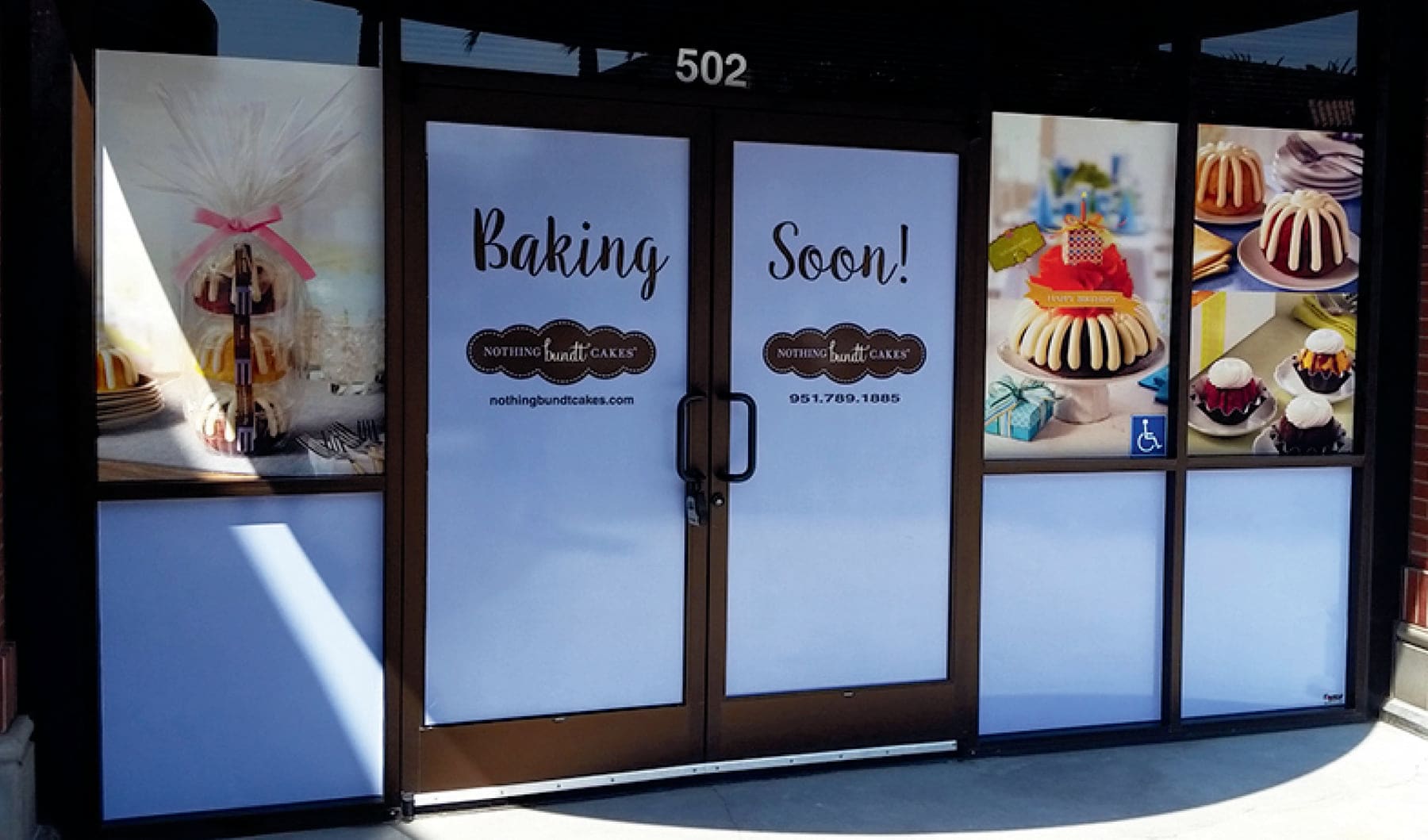 Bakery storefront with frosted privacy film on the lower glass and full-color printed window graphics above